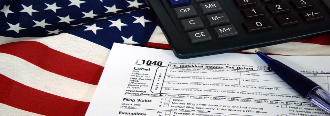 1040 Tax Form with calculator and flag